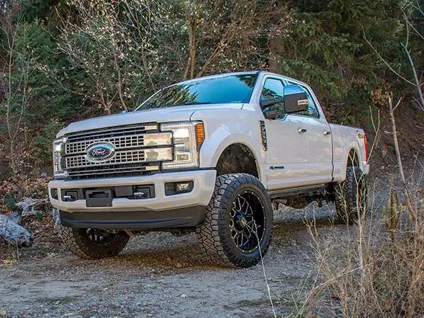 Tuff Country Tuff Country 24997KN 4" Lift Kit with Radius Arms Drop Brackets with Coil Springs Rear Blocks and U-Bolts with SX8000 Shocks - Vehicle Parts & Accessories Lift Kits